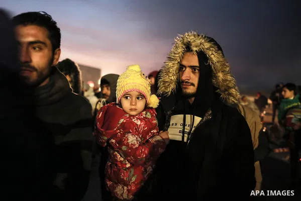 A picture taken on March 1, 2020. Refugees light fires to warm themseleves at the Ipsala border gate in Edirne, on the Turkish-Greek border. Migrants and refugees hoping to enter Greece from Turkey appeared to be fanning...
