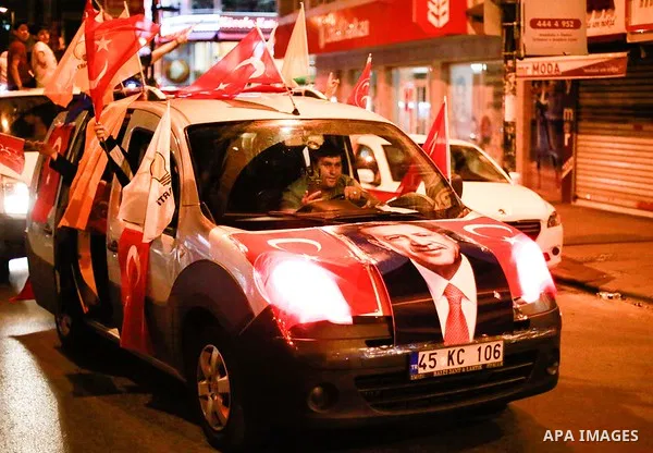 A picture taken on June 24, 2018 shows Supporters of Turkish President Recep Tayyip Erdogan celebrate the results of the Turkish presidential and parliamentary elections, in Istanbul, Turkey. Photo by Shady al-Assar
