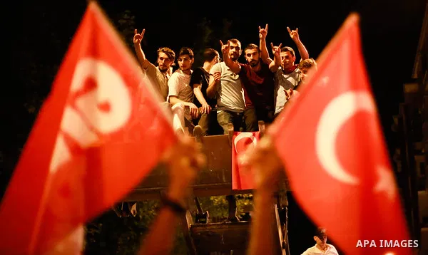 A picture taken on June 24, 2018 shows Supporters of Turkish President Recep Tayyip Erdogan celebrate the results of the Turkish presidential and parliamentary elections, in Istanbul, Turkey. Photo by Shady al-Assar