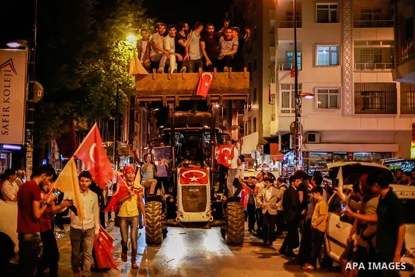 A picture taken on June 24, 2018 shows Supporters of Turkish President Recep Tayyip Erdogan celebrate the results of the Turkish presidential and parliamentary elections, in Istanbul, Turkey. Photo by Shady al-Assar