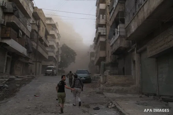 Syrians inspect the damage following a reported bomb barrel attack by Syrian government forces hit at a popular marketplace at al-Ma'adi neighborhood in the northern Syrian city of Aleppo, July 7, 2015. Photo by Ameer al...