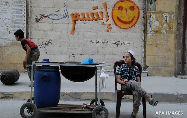 A Syrian street vendor sells juices at a popular marketplace in the northern Syrian city of Aleppo, on July 4, 2015. During Ramadan, Muslim believers abstain from eating, drinking, smoking and having sex from dawn until...