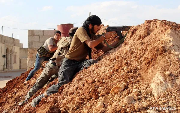 Fighters from the Free Syrian Army's Al-Tawhid Brigade take their position at the border with Dabiq city, the stronghold of the ISIS fighters, in the Mare' city in the north of Aleppo, on June 30, 2015. Photo by Ameer al...