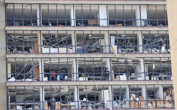 A picture shows damaged buildings in Beirut on August 7, 2020, three days after a colossal explosion of a huge pile of ammonium nitrate that had languished for years in a port warehouse left scores of people dead or inju...