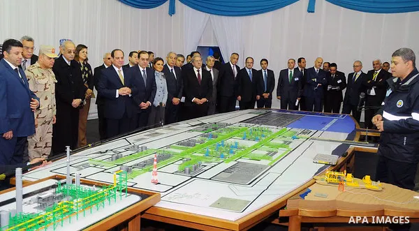 Egyptian President Abdel Fattah al-Sisi looks at mockups of natural gas extraction facilities during the inauguruation of the offshore Zohr gas field in the northern Suez canal city of Port Said, on January 31, 2018. At...