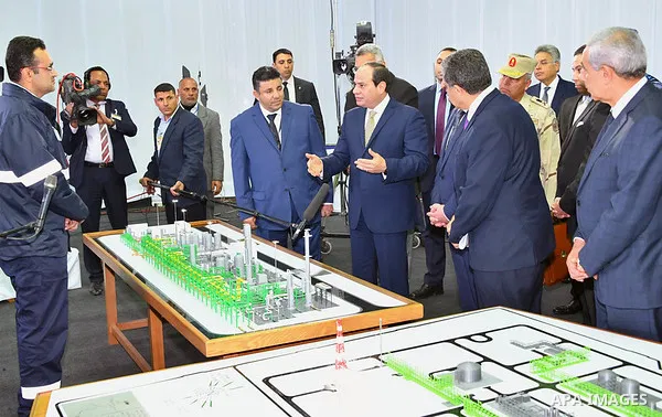 Egyptian President Abdel Fattah al-Sisi looks at mockups of natural gas extraction facilities during the inauguruation of the offshore Zohr gas field in the northern Suez canal city of Port Said, on January 31, 2018. At...