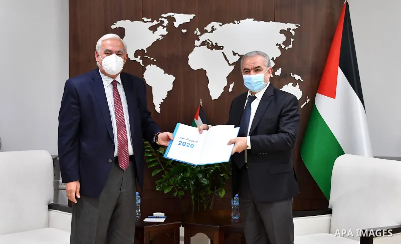 Palestinian Prime Minister Mohammad Ishtayeh, receive the annual performance report of the Water Sector Regulatory Council for the year 2020, in the West Bank city of Ramallah, on January 10, 2021. Photo by Prime Ministe...
