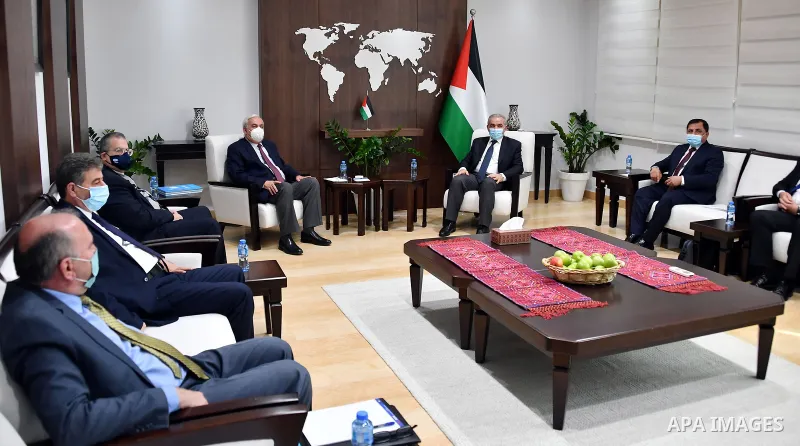Palestinian Prime Minister Mohammad Ishtayeh, receive the annual performance report of the Water Sector Regulatory Council for the year 2020, in the West Bank city of Ramallah, on January 10, 2021. Photo by Prime Ministe...