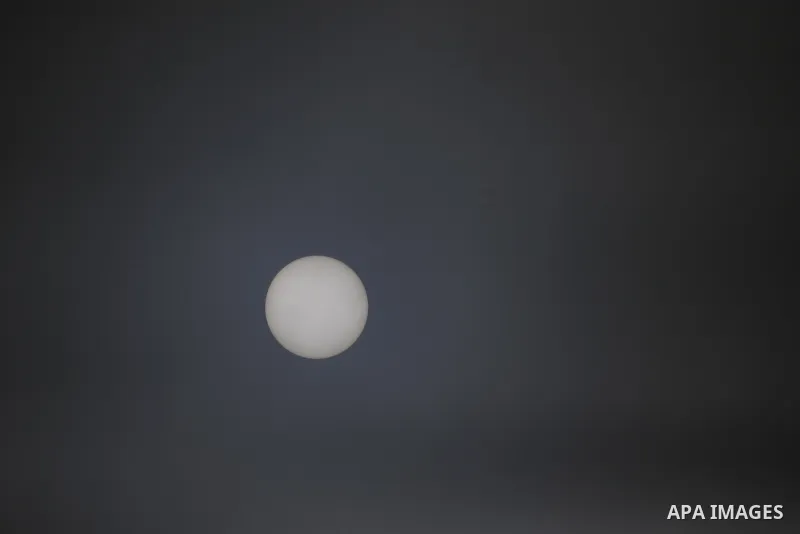 A picture taken on January 10, 2021, shows the sun's disk during a heavy fog, in Gaza city. Photo by Osama Baba