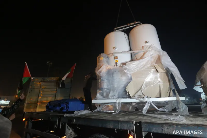 Palestinians receive medical aid from the United Arab Emirate, in Rafah border crossing in the southern of Gaza Strip, on January 10, 2021. The second shipment of Emirati medical aid arrived in the Gaza Strip this evenin...