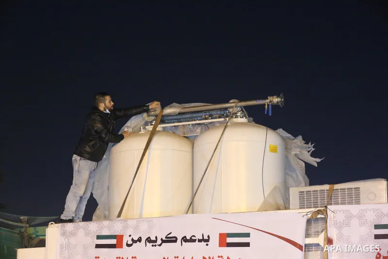 Palestinians receive medical aid from the United Arab Emirate, in Rafah border crossing in the southern of Gaza Strip, on January 10, 2021. The second shipment of Emirati medical aid arrived in the Gaza Strip this evenin...
