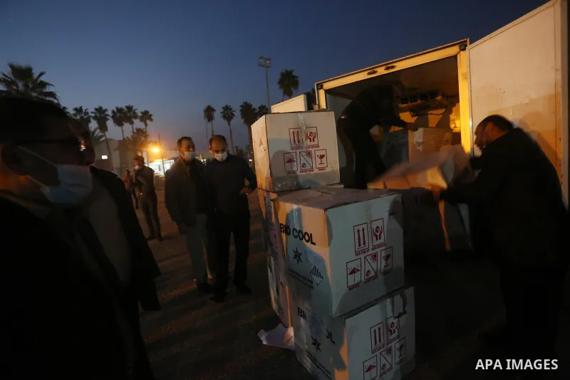 Palestinians receive medical aid from the United Arab Emirate, in Rafah border crossing in the southern of Gaza Strip, on January 10, 2021. The second shipment of Emirati medical aid arrived in the Gaza Strip this evenin...