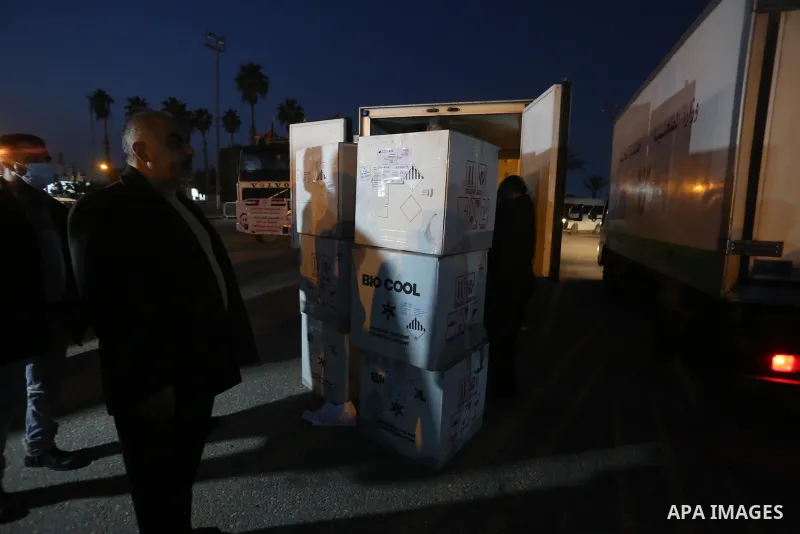Palestinians receive medical aid from the United Arab Emirate, in Rafah border crossing in the southern of Gaza Strip, on January 10, 2021. The second shipment of Emirati medical aid arrived in the Gaza Strip this evenin...