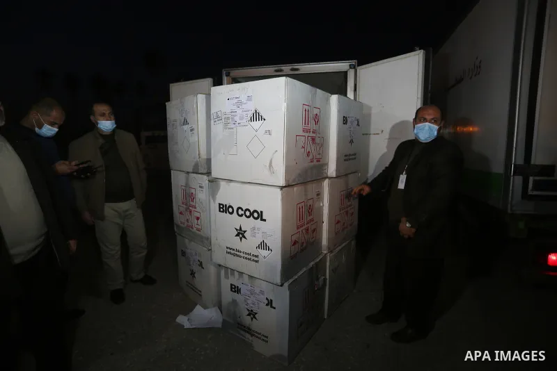 Palestinians receive medical aid from the United Arab Emirate, in Rafah border crossing in the southern of Gaza Strip, on January 10, 2021. The second shipment of Emirati medical aid arrived in the Gaza Strip this evenin...