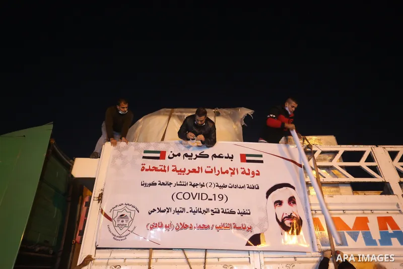 Palestinians receive medical aid from the United Arab Emirate, in Rafah border crossing in the southern of Gaza Strip, on January 10, 2021. The second shipment of Emirati medical aid arrived in the Gaza Strip this evenin...