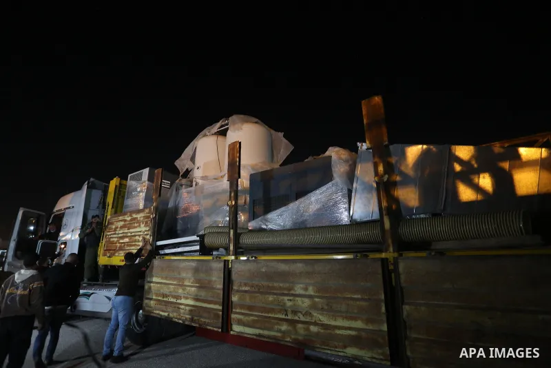 Palestinians receive medical aid from the United Arab Emirate, in Rafah border crossing in the southern of Gaza Strip, on January 10, 2021. The second shipment of Emirati medical aid arrived in the Gaza Strip this evenin...