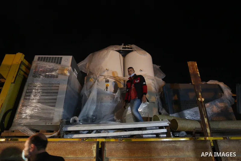 Palestinians receive medical aid from the United Arab Emirate, in Rafah border crossing in the southern of Gaza Strip, on January 10, 2021. The second shipment of Emirati medical aid arrived in the Gaza Strip this evenin...