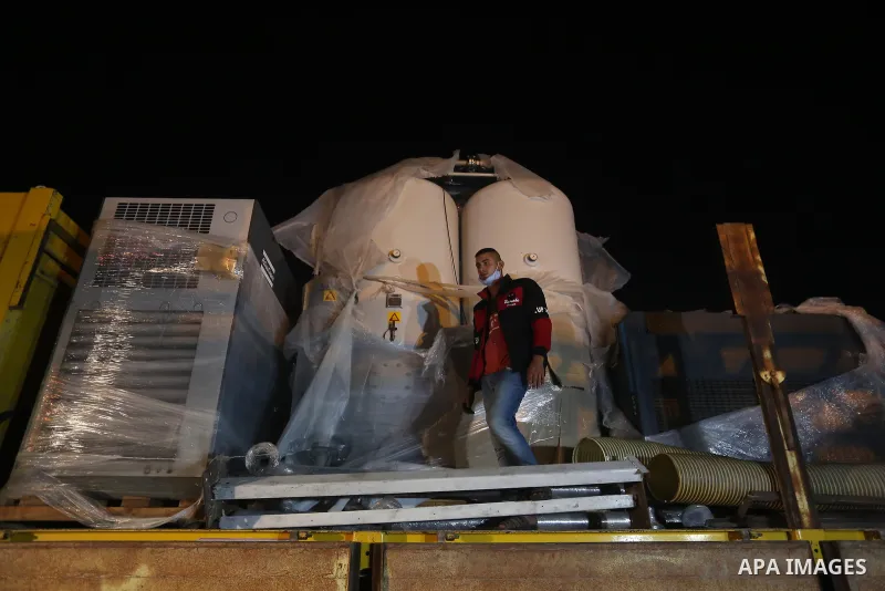 Palestinians receive medical aid from the United Arab Emirate, in Rafah border crossing in the southern of Gaza Strip, on January 10, 2021. The second shipment of Emirati medical aid arrived in the Gaza Strip this evenin...