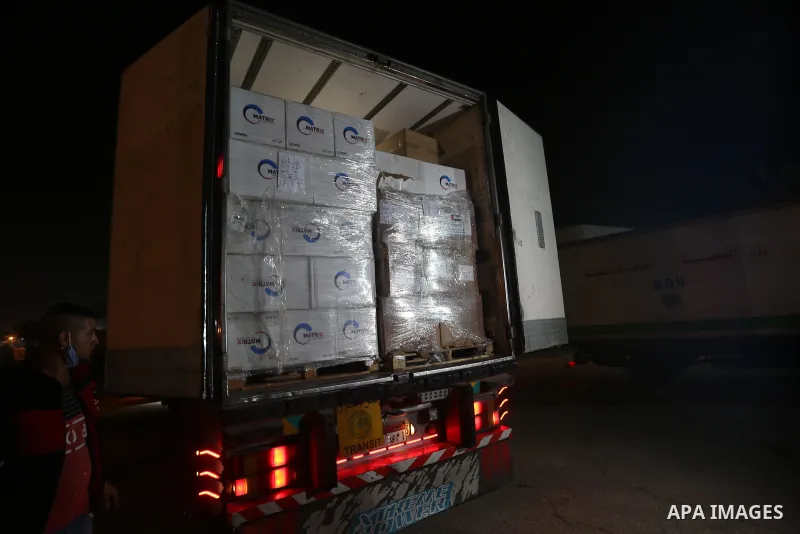 Palestinians receive medical aid from the United Arab Emirate, in Rafah border crossing in the southern of Gaza Strip, on January 10, 2021. The second shipment of Emirati medical aid arrived in the Gaza Strip this evenin...