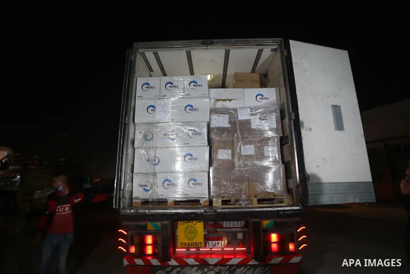 Palestinians receive medical aid from the United Arab Emirate, in Rafah border crossing in the southern of Gaza Strip, on January 10, 2021. The second shipment of Emirati medical aid arrived in the Gaza Strip this evenin...