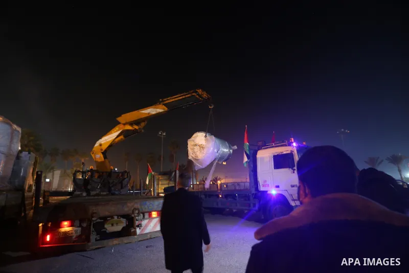 Palestinians receive medical aid from the United Arab Emirate, in Rafah border crossing in the southern of Gaza Strip, on January 10, 2021. The second shipment of Emirati medical aid arrived in the Gaza Strip this evenin...