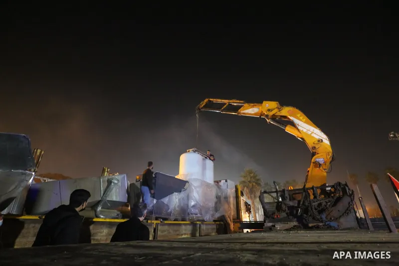 Palestinians receive medical aid from the United Arab Emirate, in Rafah border crossing in the southern of Gaza Strip, on January 10, 2021. The second shipment of Emirati medical aid arrived in the Gaza Strip this evenin...