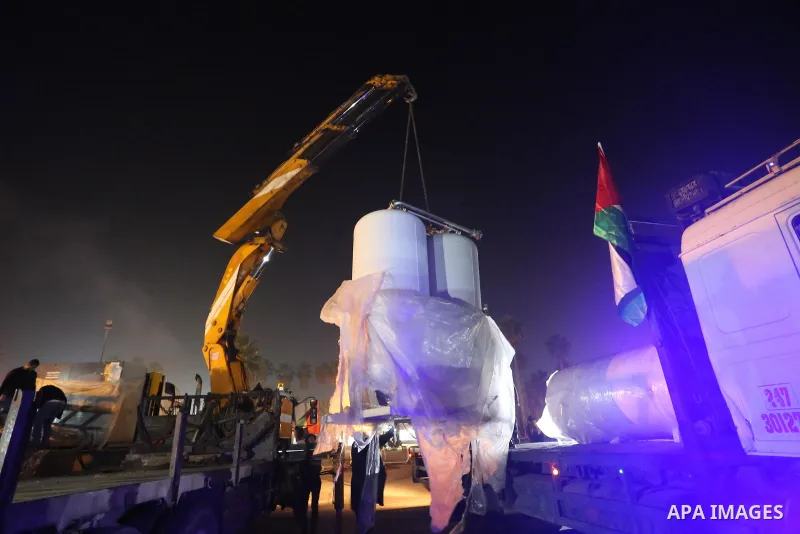 Palestinians receive medical aid from the United Arab Emirate, in Rafah border crossing in the southern of Gaza Strip, on January 10, 2021. The second shipment of Emirati medical aid arrived in the Gaza Strip this evenin...