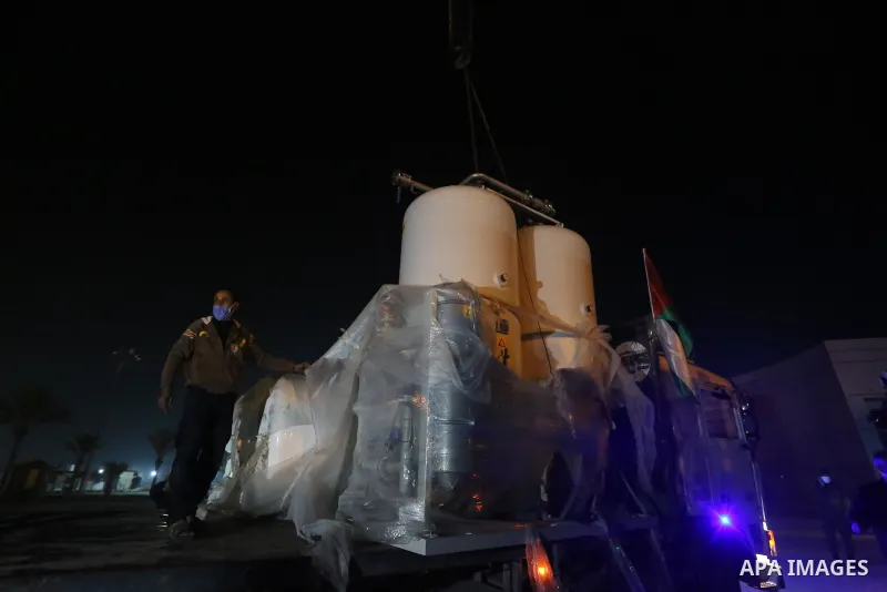 Palestinians receive medical aid from the United Arab Emirate, in Rafah border crossing in the southern of Gaza Strip, on January 10, 2021. The second shipment of Emirati medical aid arrived in the Gaza Strip this evenin...