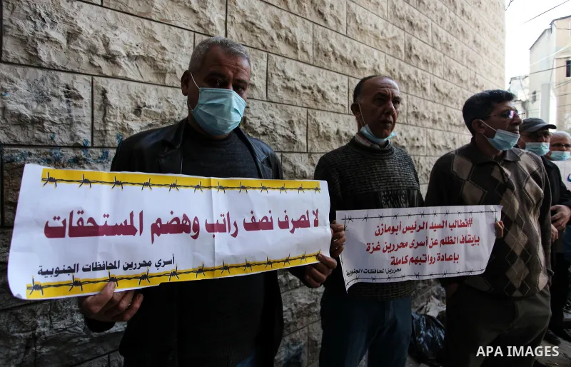 Freed Palestinian prisoners, take part in a protest to demand their rights and salaries, in Gaza city, January 11, 2021. The worst year for prisoners in Israeli jails where some 4,400 Palestinians are currently incarcera...