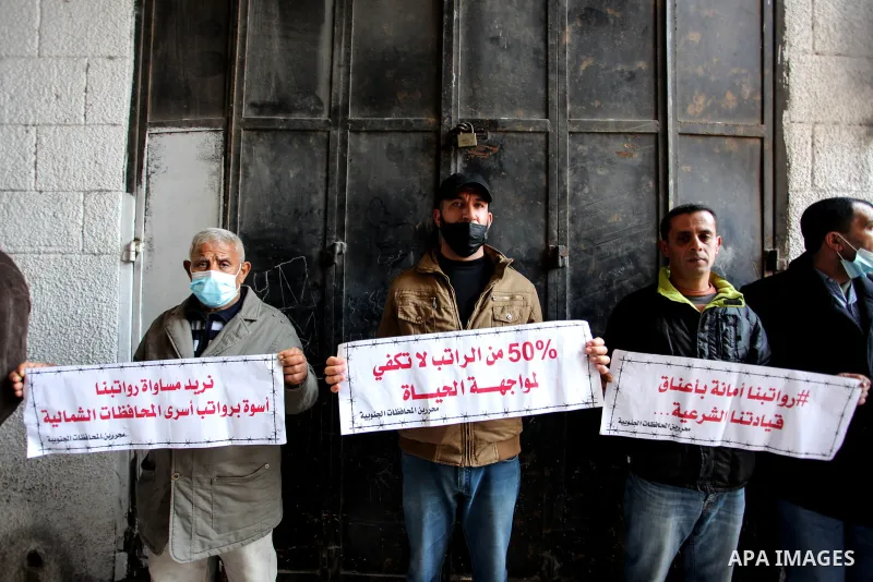 Freed Palestinian prisoners, take part in a protest to demand their rights and salaries, in Gaza city, January 11, 2021. The worst year for prisoners in Israeli jails where some 4,400 Palestinians are currently incarcera...