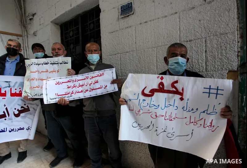 Freed Palestinian prisoners, take part in a protest to demand their rights and salaries, in Gaza city, January 11, 2021. The worst year for prisoners in Israeli jails where some 4,400 Palestinians are currently incarcera...
