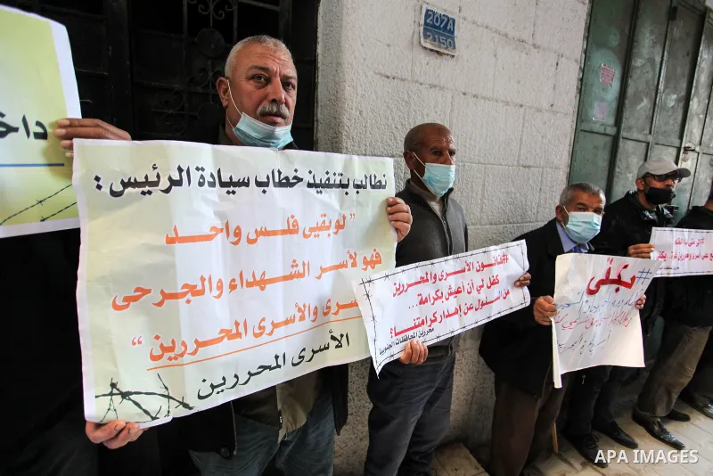 Freed Palestinian prisoners, take part in a protest to demand their rights and salaries, in Gaza city, January 11, 2021. The worst year for prisoners in Israeli jails where some 4,400 Palestinians are currently incarcera...