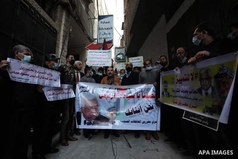 Freed Palestinian prisoners, take part in a protest to demand their rights and salaries, in Gaza city, January 11, 2021. The worst year for prisoners in Israeli jails where some 4,400 Palestinians are currently incarcera...