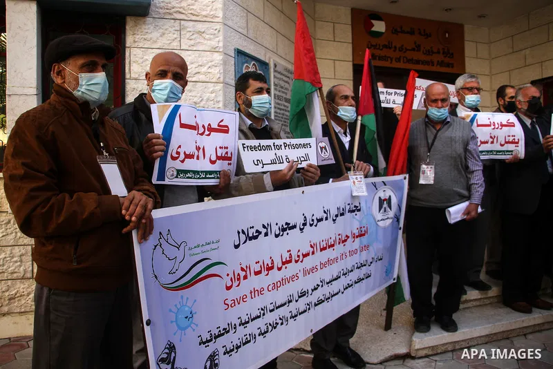 Palestinians attend a press confernce about the spread of the coronavirus disease (COVID-19) in Israeli jails, in Gaza city on January 19, 2021. According to the Palestinian Prisoners’ Club, about 250 Palestinians in Isr...