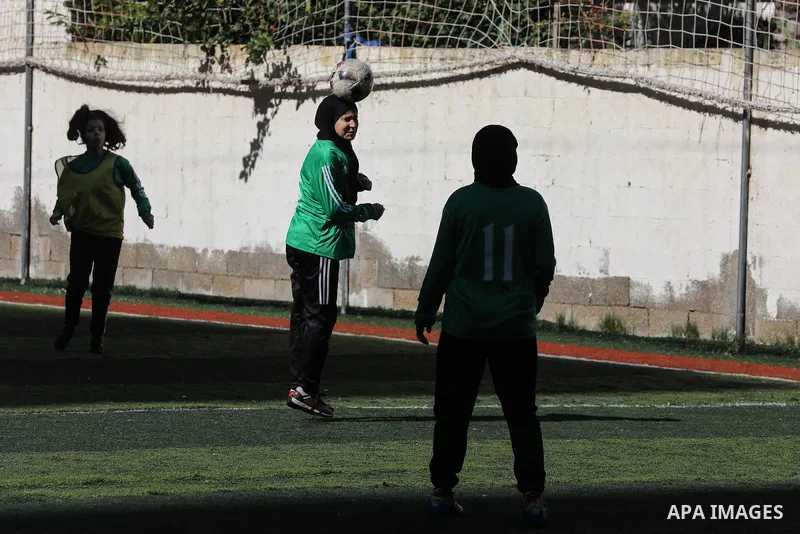Palestinian girls take part in a local football competition in Gaza City January 21, 2021. Women's association football, usually known as women's football or women's soccer, and colloquially WOSO, is the team sport of as...