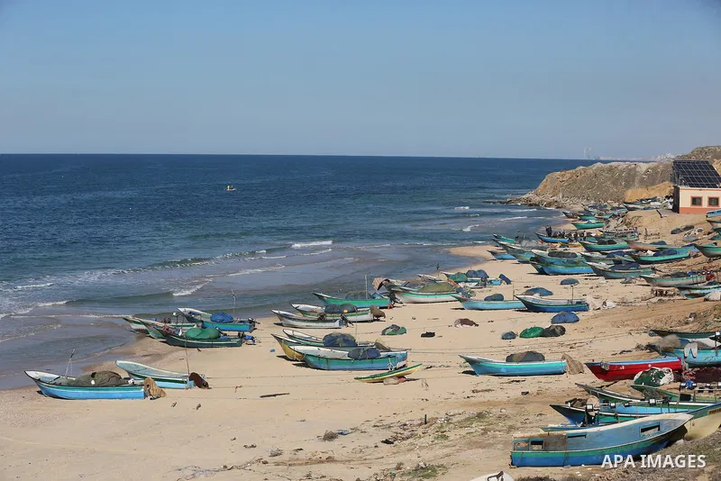 Palestinians enjoy their time on the beach after the coronavirus disease (COVID-19) restrictions eased, in Deir Al-Balah in the center of the Gaza Strip on January 23, 2021, the Ministry of Interior announced a series of...