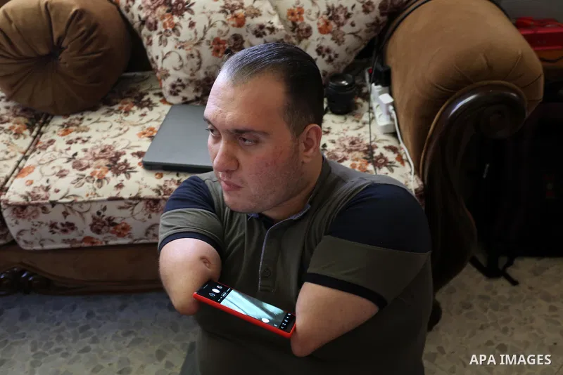 Disabled Palestinian man Youssef Abu Amira uses his mobile phone at his home in Gaza City January 25, 2021. Para-karate is the newest evolution of the martial art discipline that evolved in Japan. The new class of karate...