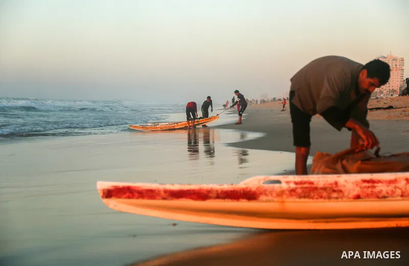 Palestinians enjoy their time on the beach, amid the outbreak of the coronavirus disease (COVID-19), in Gaza city on, on January 30, 2021. The Ministry of Interior announced a series of measures to alleviate the restrict...