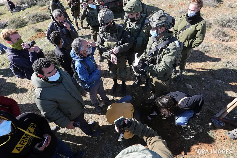 Israeli army prevent Palestinians from cultivating their lands in Khirbet Umm Khoussa in the West Bank city of Hebron, January 30, 2021. Mashhor Wahwah / WAFA