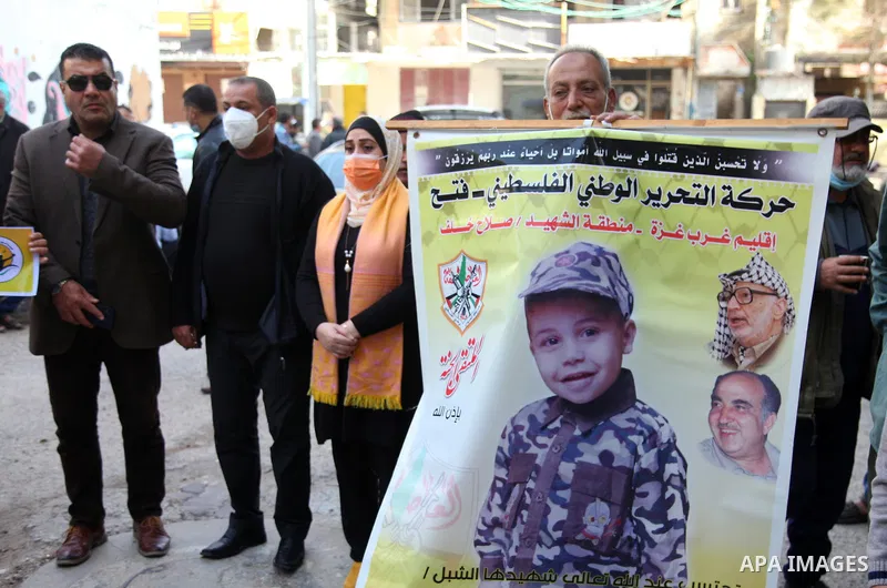 Palestinian families of martyrs and woundeds wearing protective face masks, as they take part in a protest to demand their rights and salaries, in Gaza city, on February 2, 2021. Elections would pose a major risk for Abb...