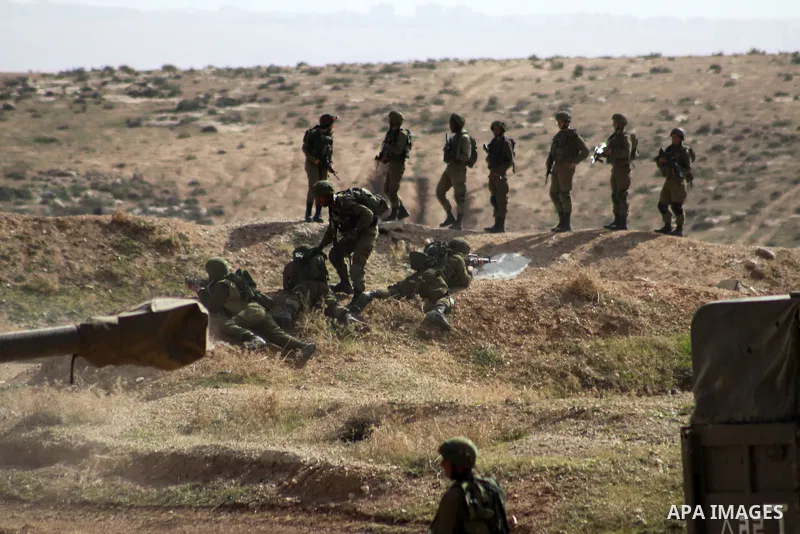 An Israeli army artillery unit takes part in a training session south of the Palestinian village of Yatta, in area C (where Israel retains control) on the outskirts of the town of Hebron, in the West Bank on February 2,...