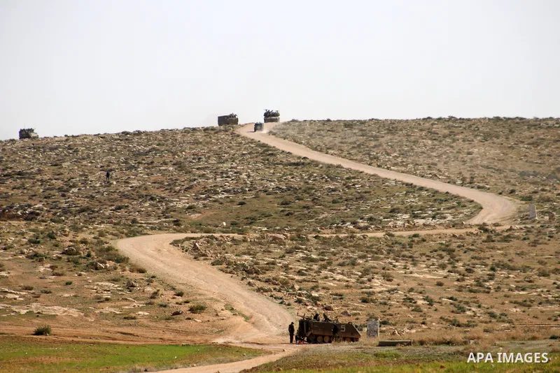 An Israeli army artillery unit takes part in a training session south of the Palestinian village of Yatta, in area C (where Israel retains control) on the outskirts of the town of Hebron, in the West Bank on February 2,...