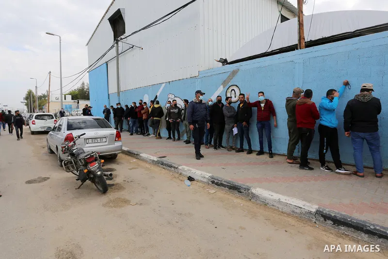 Palestinian citizens and drivers wait to file their complaints in front of the Traffic Police headquarters in Deir al-Balah, central of Gaza Strip on February 4, 2021. The General Administration of Traffic and Rescue Pol...