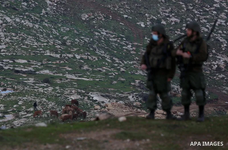 Israeli security forces take position during a demonstration against the expansion of settlements, in Beit Dajan in the Israeli-occupied West Bank on February 5, 2021. There are over 700,000 Israeli settlers living in co...