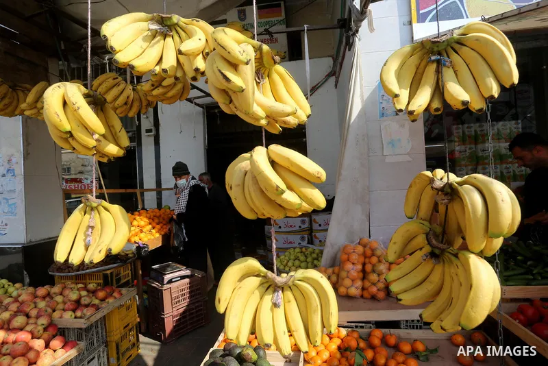 Palestinians shop at a market in Deir Al-Balah in the center of the Gaza Strip, on February 06, 2021. After the decision to ease the preventive measures taken by lifting the ban and daily night closings, and lifting the...