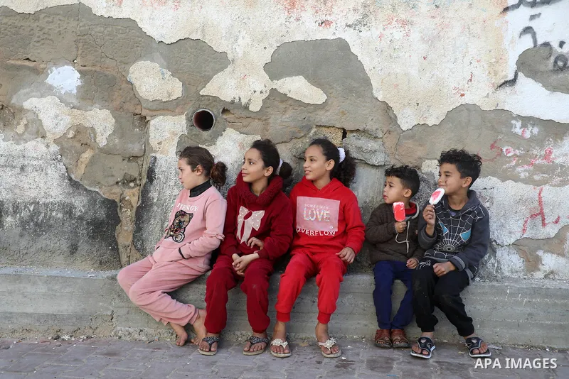 Palestinian children enjoy in al-Shati refugee camp in Gaza City on February 7, 2021. Photo by Mahmoud Ajjour