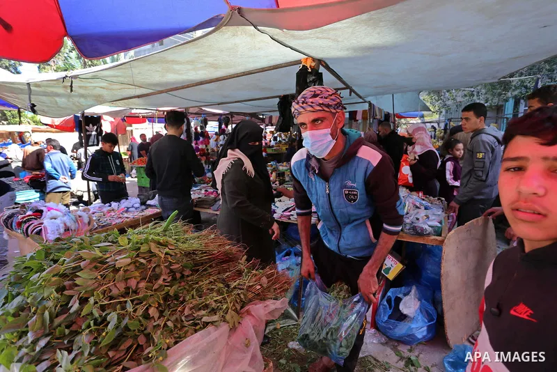 Palestinians shop at a popular market after lifting the state of closure, in Deir El-Balah, in the center of the Gaza Strip, on February 09, 2021. The Undersecretary of the Ministry of Local Government stated, "The decis...
