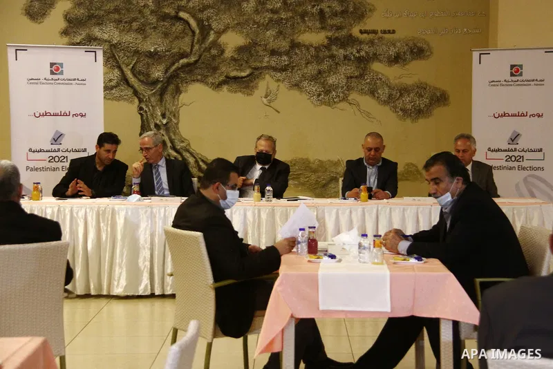A delegation from the Palestinian Central Elections Commission, attend a meeting after arrives in the Gaza Strip, on February 09, 2021. On Tuesday, a delegation from the Palestinian Central Elections Commission arrived i...