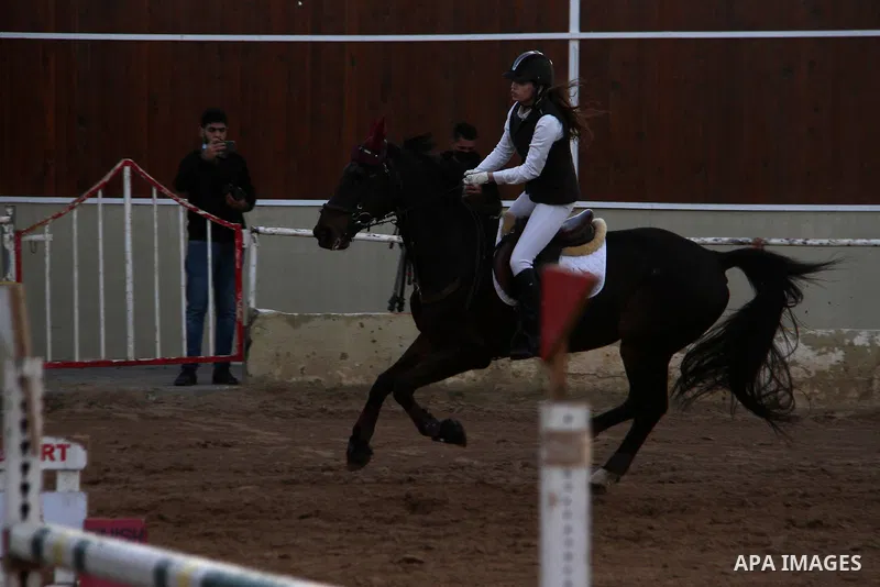 Palestinian competitors ride their horses during local show, amid the spread of the Coronavirus COVID-19, in Gaza City on February 09, 2021. Wearing riding pants, logo-decorated shirts and helmets, Gaza horse-riders resu...