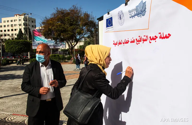 Palestinians from "PCDCR" take part in a protest against hate speech, in Gaza city, on February 11, 2021. Project a protective environment of hate speech and supportive of freedom of opinion and expression in the Gaza St...